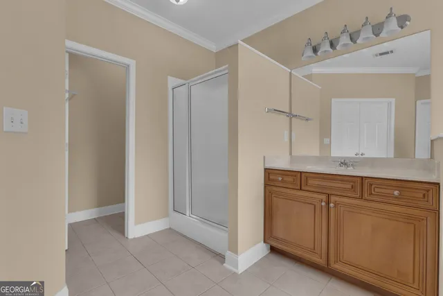 a view of staircase with wooden floor and white walls