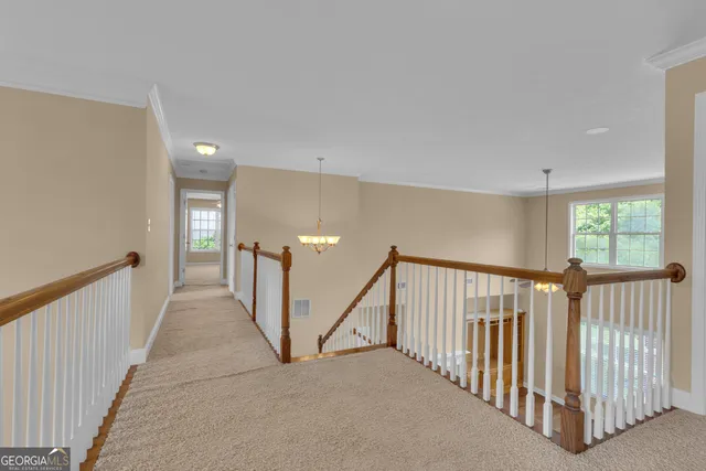 a view of a house with wooden floor and fence