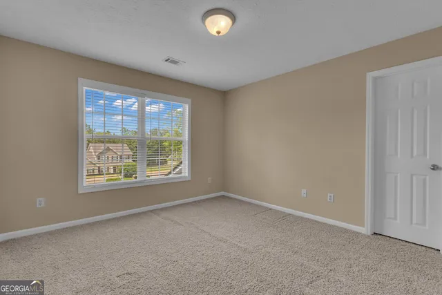 a view of a wooden deck with a chair and table