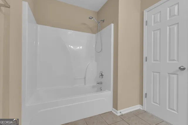 a swimming pool with outdoor seating and yard