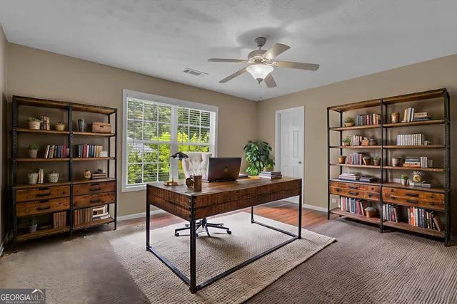 a view of a backyard with a garden and deck