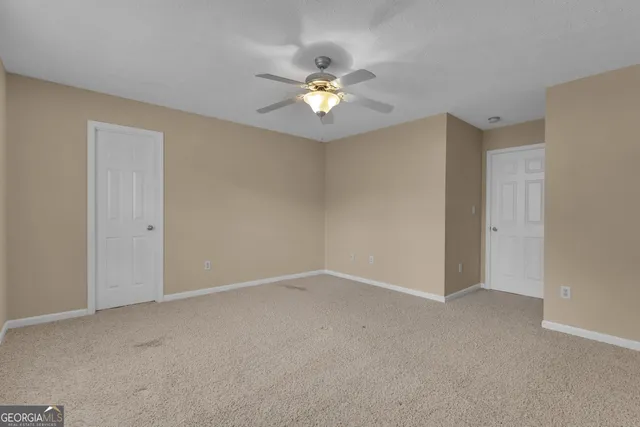 a front view of a house with a yard table and chairs