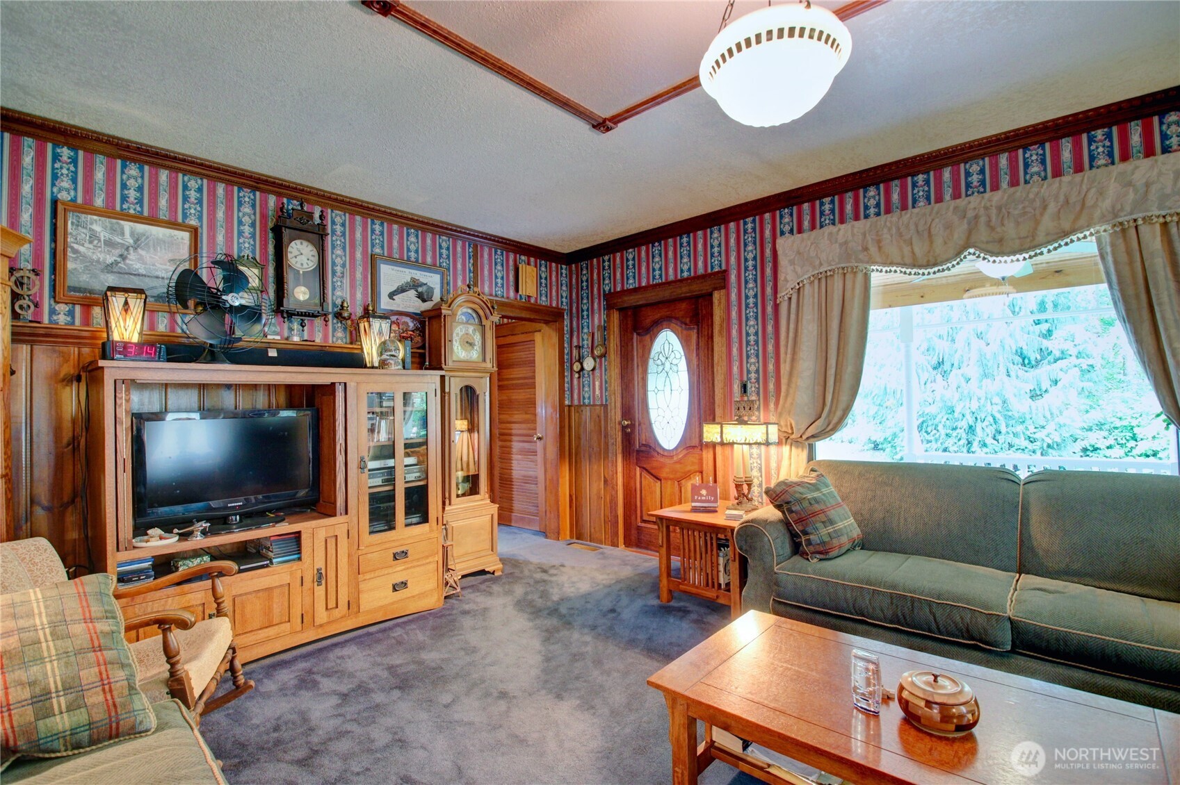 2909 Overpass Road Bow, WA 98232 - Photo 10 of 40 a living room with furniture and a flat screen tv