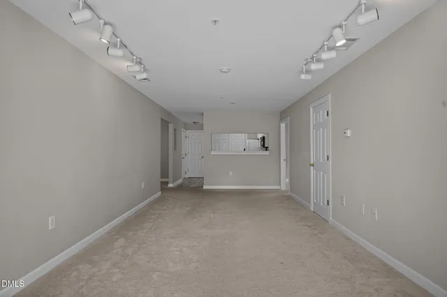a kitchen with white cabinets stainless steel appliances and sink