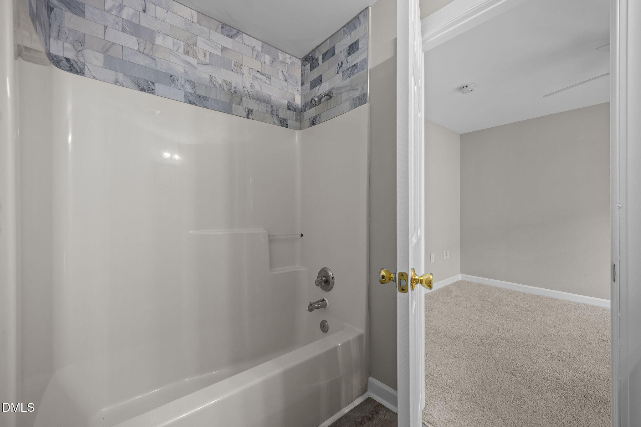 929 Morreene Road, Unit A23 Durham, NC 27705 - Photo 21 of 50 a bathroom with a bathtub and a shower