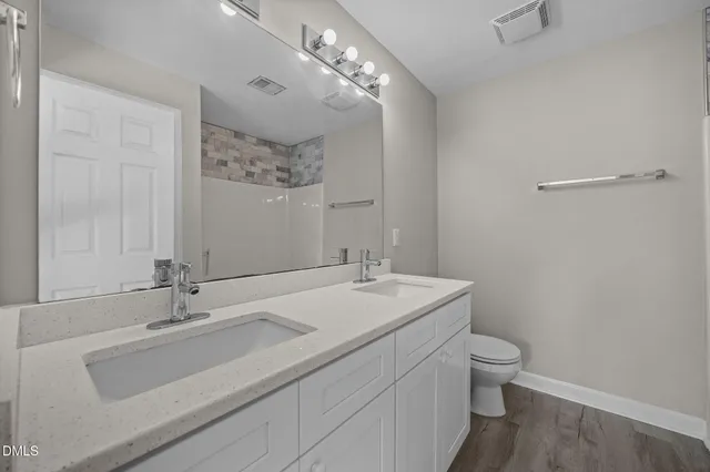 a view of a balcony with wooden floor and windows
