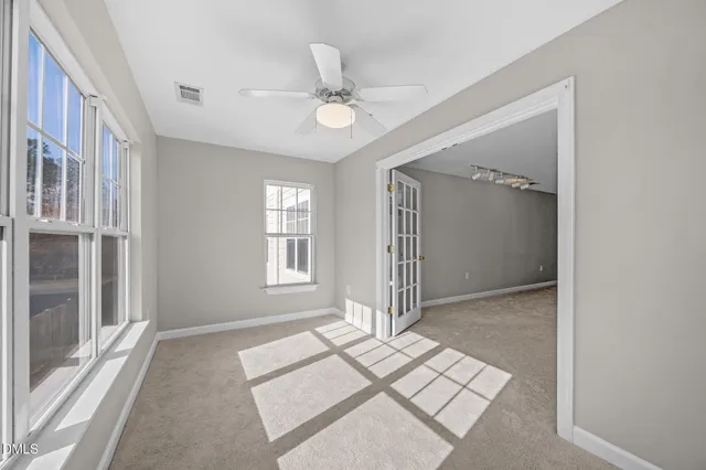 a view of a balcony with wooden floor