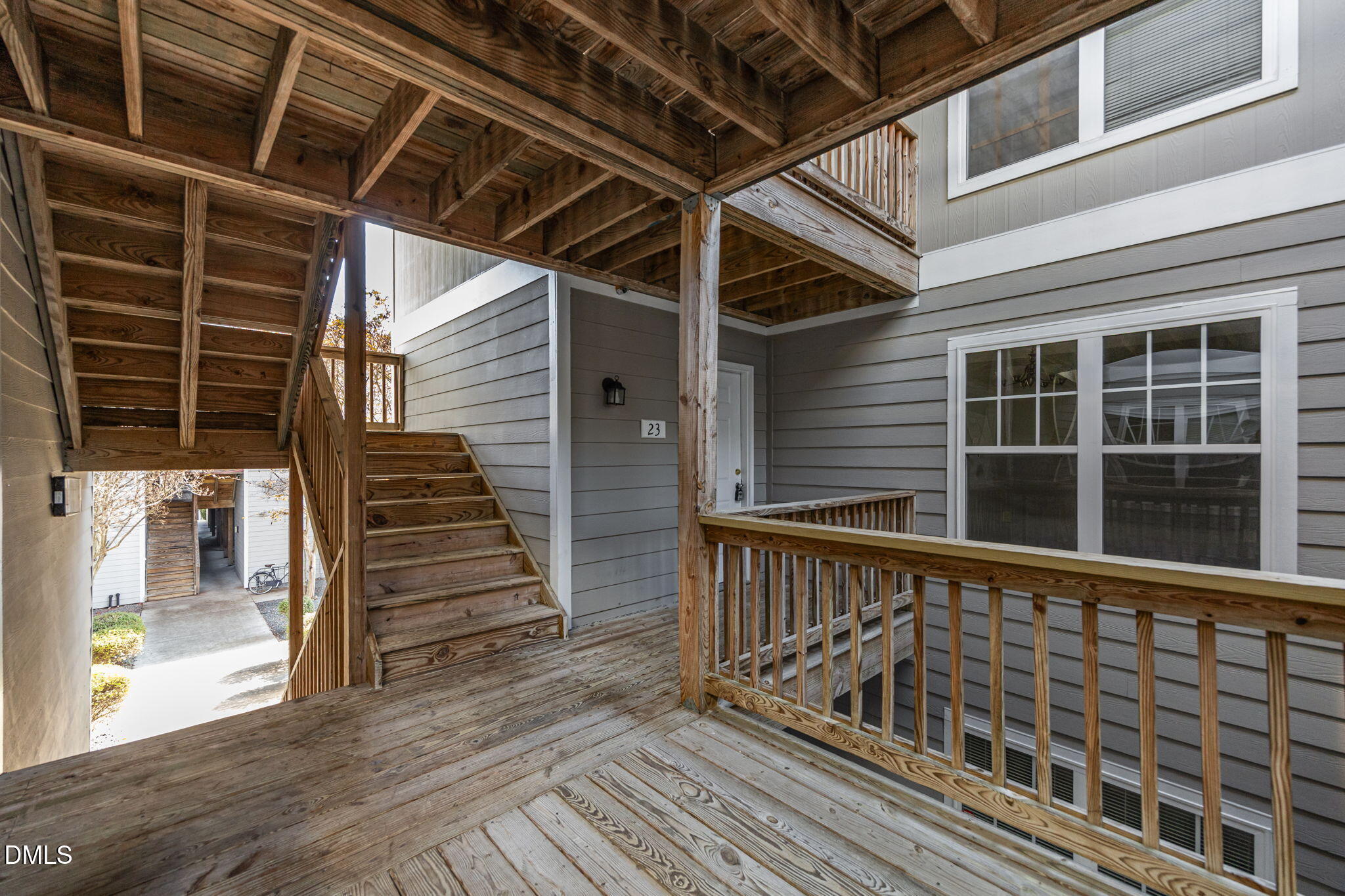929 Morreene Road, Unit A23 Durham, NC 27705 - Photo 34 of 50 a view of a balcony with wooden floor and windows