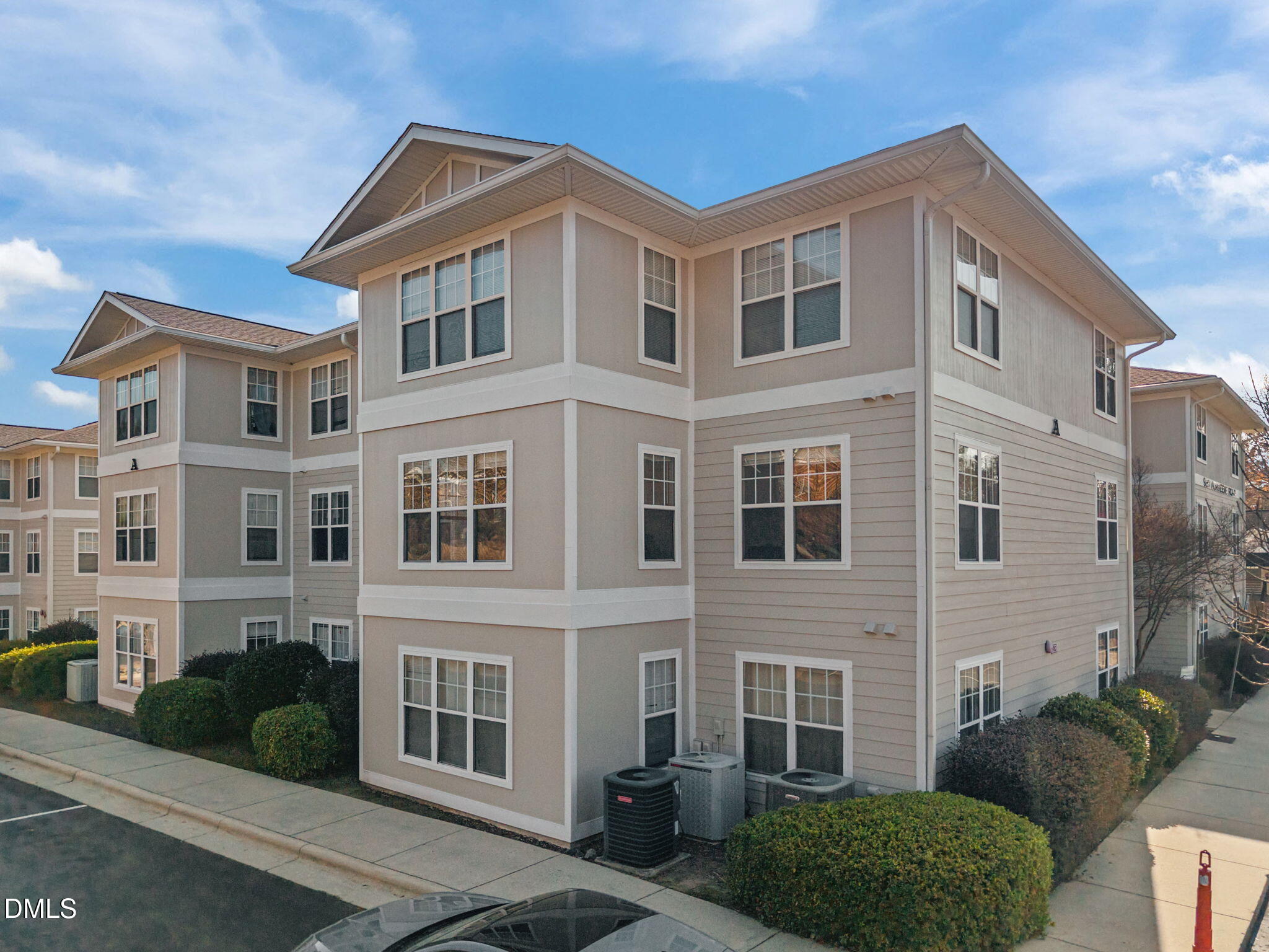929 Morreene Road, Unit A23 Durham, NC 27705 - Photo 4 of 50 a front view of a house with a yard