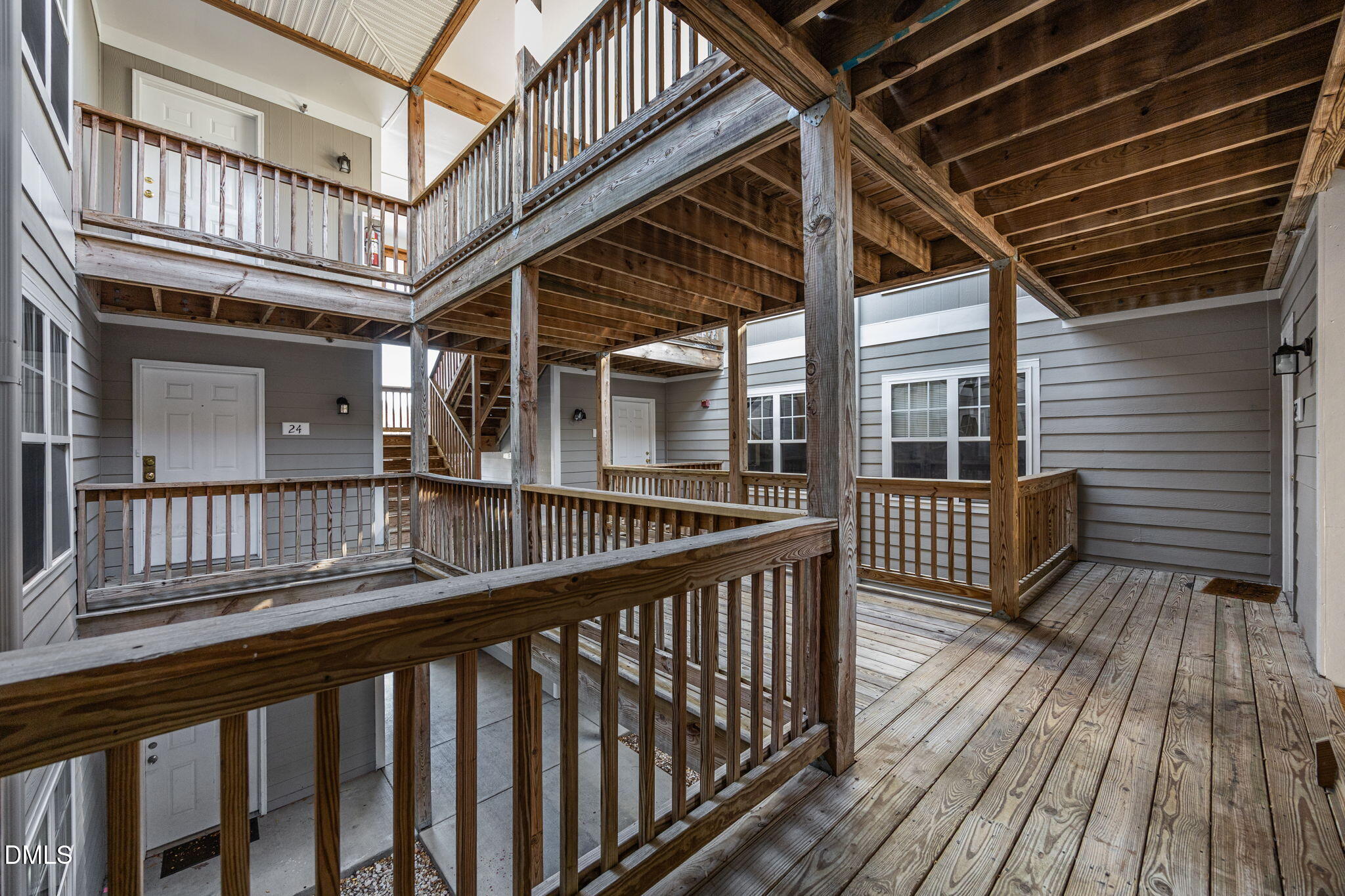 929 Morreene Road, Unit A23 Durham, NC 27705 - Photo 43 of 50 a view of a balcony with wooden floor