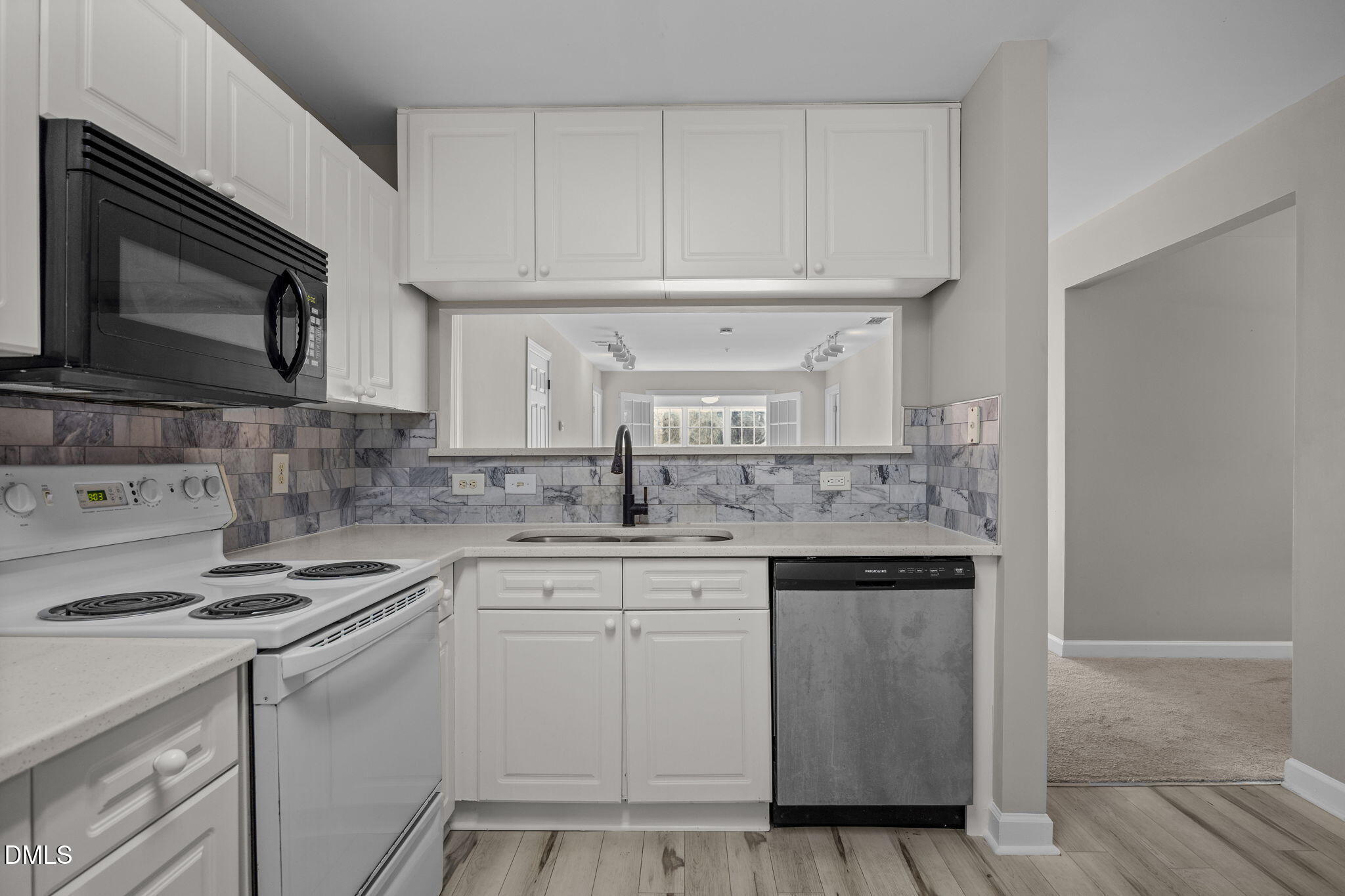 929 Morreene Road, Unit A23 Durham, NC 27705 - Photo 9 of 50 a kitchen with stainless steel appliances granite countertop a sink and a stove