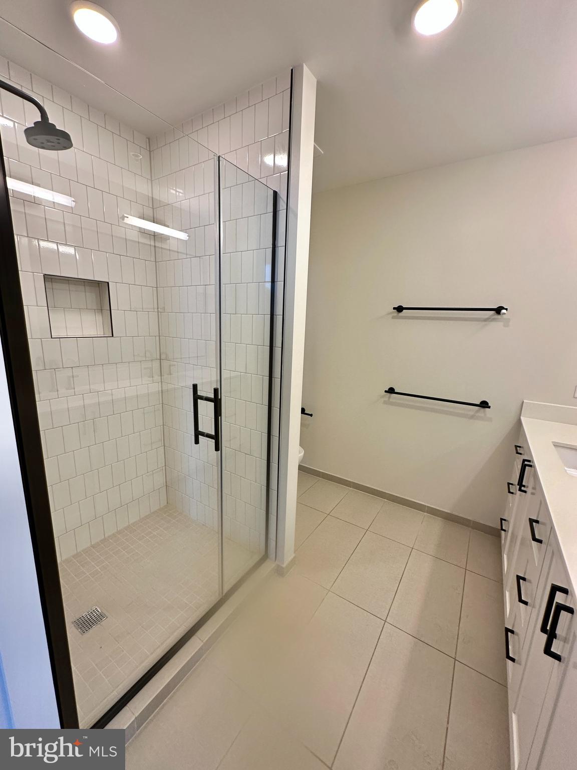 1211 Van Street Southeast, Unit 1201 Washington, DC 20003 - Photo 25 of 58 a bathroom with a shower and toilet