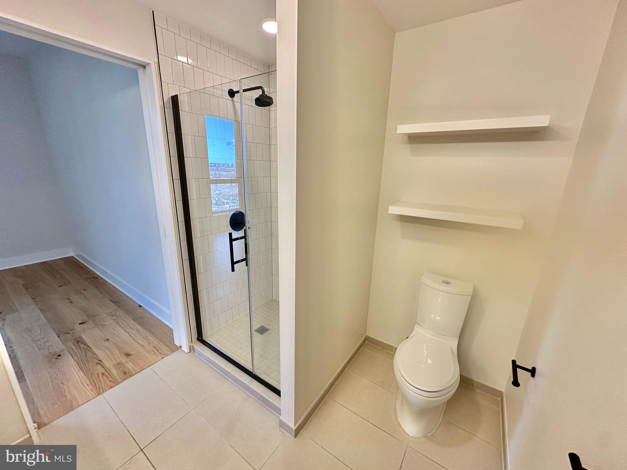 1211 Van Street Southeast, Unit 1201 Washington, DC 20003 - Photo 27 of 58 a bathroom with a toilet and a shower