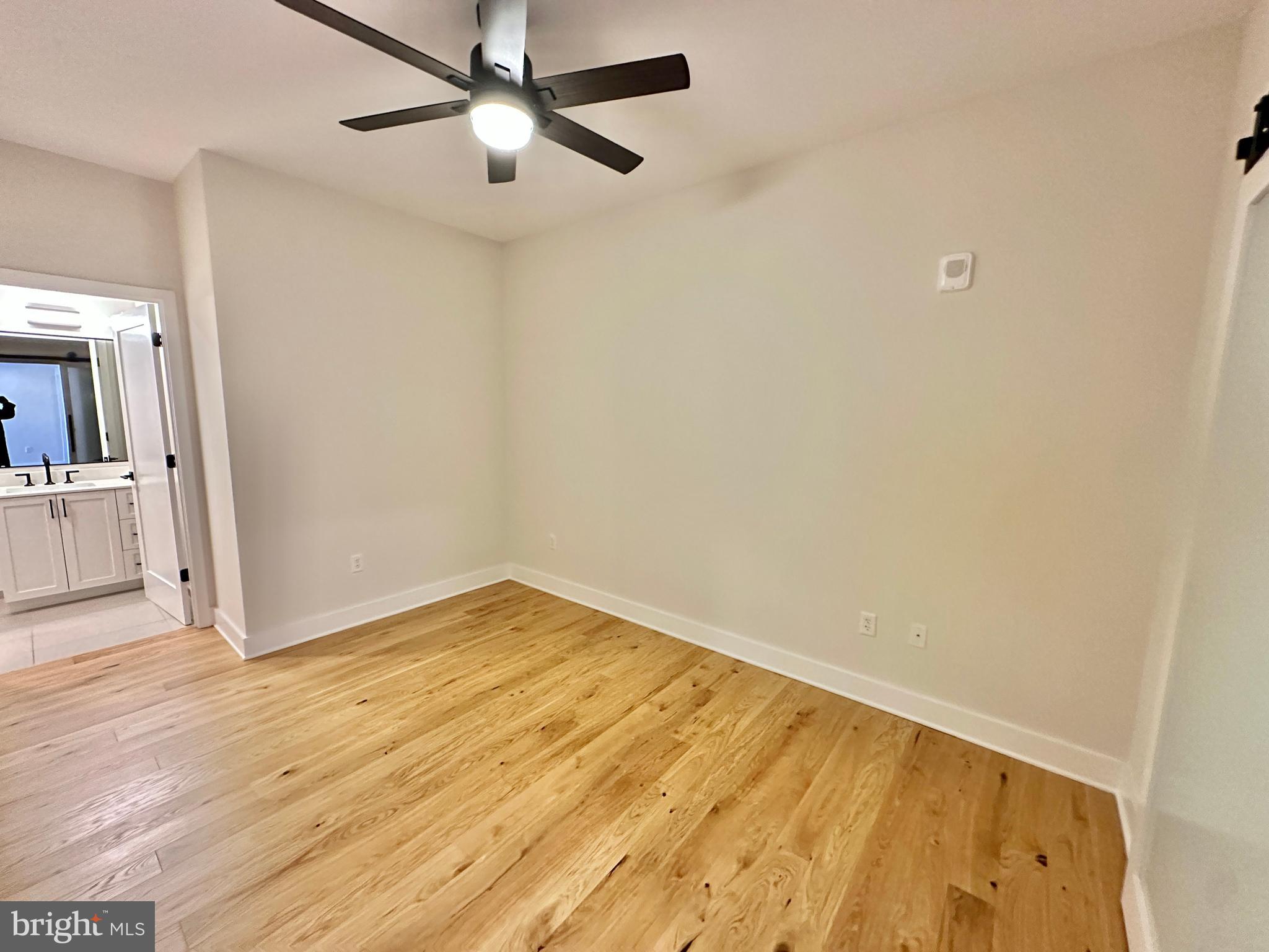1211 Van Street Southeast, Unit 1201 Washington, DC 20003 - Photo 29 of 58 a view of empty room with wooden floor