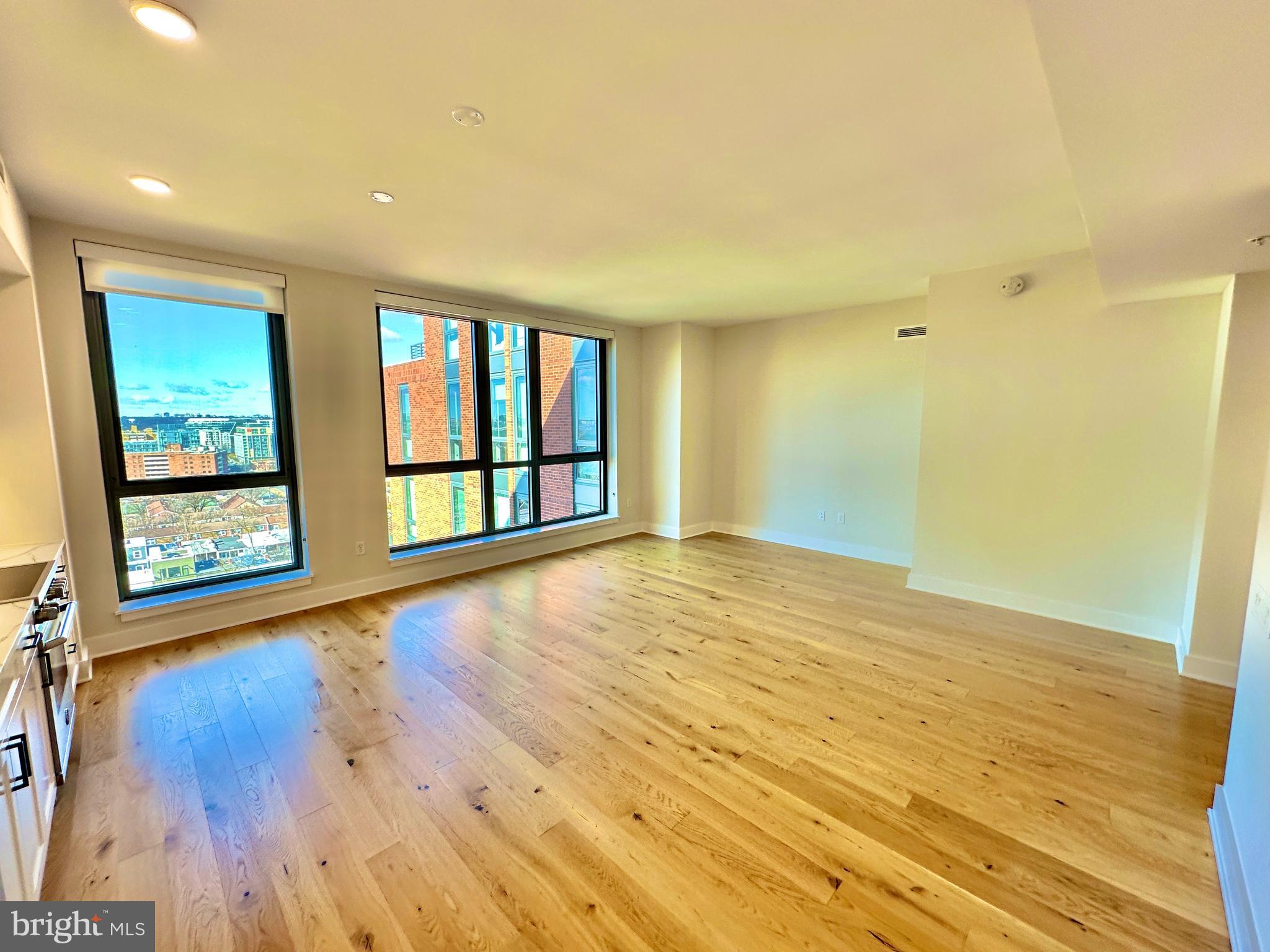 1211 Van Street Southeast, Unit 1201 Washington, DC 20003 - Photo 6 of 58 wooden floor in an empty room with a window