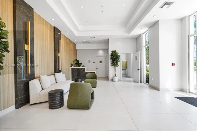 a spacious bathroom with a tub sink and mirror
