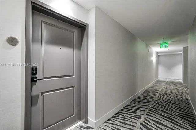 a kitchen with a refrigerator and a sink