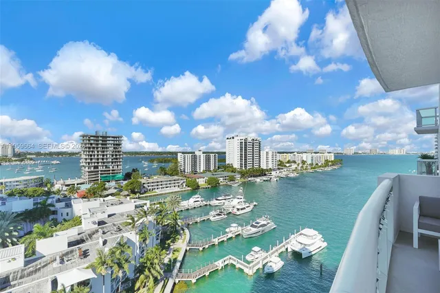 a kitchen with stainless steel appliances granite countertop a refrigerator stove and microwave