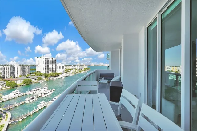 a kitchen with stainless steel appliances kitchen island a refrigerator sink and stove