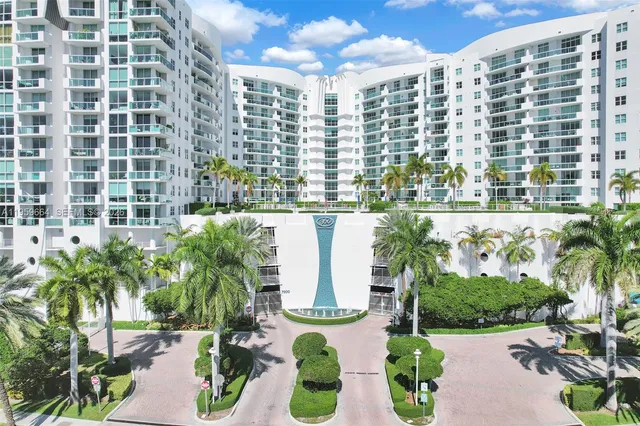 a view of a swimming pool with a lounge chair