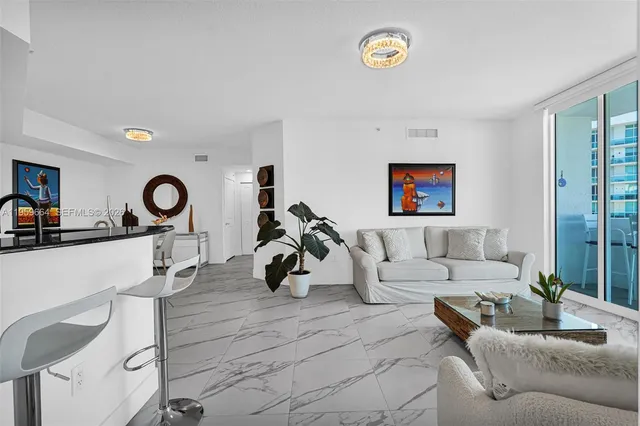 a living room with furniture and a mirror