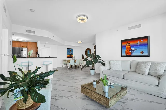 a bedroom with a bed window and a flat screen tv