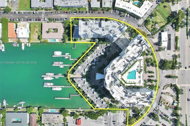 an aerial view of a house with a ocean view