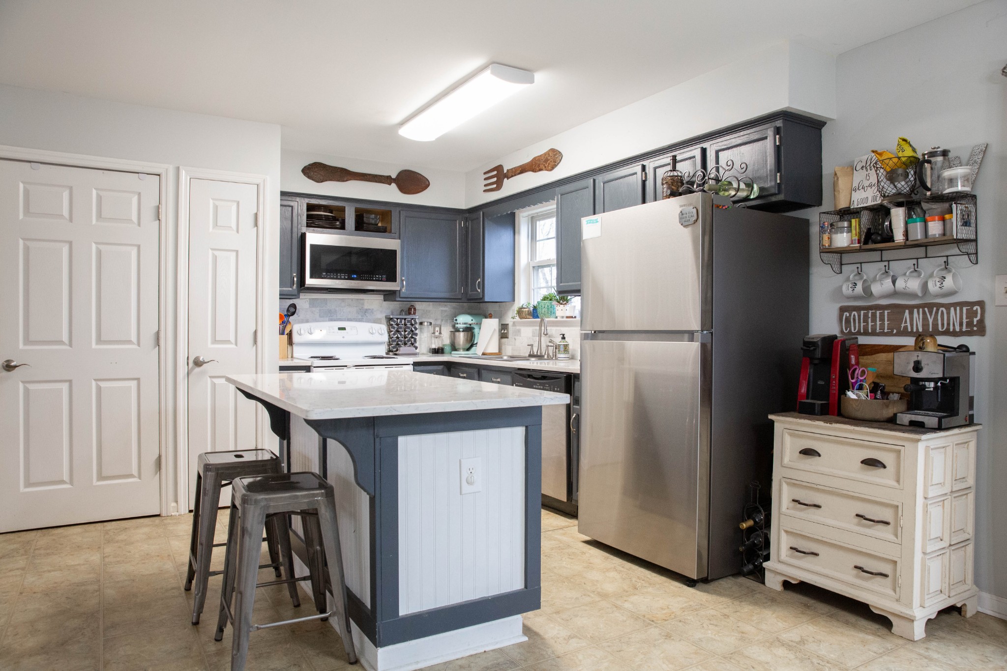 3633 Rutherford Drive Spring Hill, TN 37174 - Photo 6 of 26 a kitchen with stainless steel appliances a refrigerator and a stove top oven