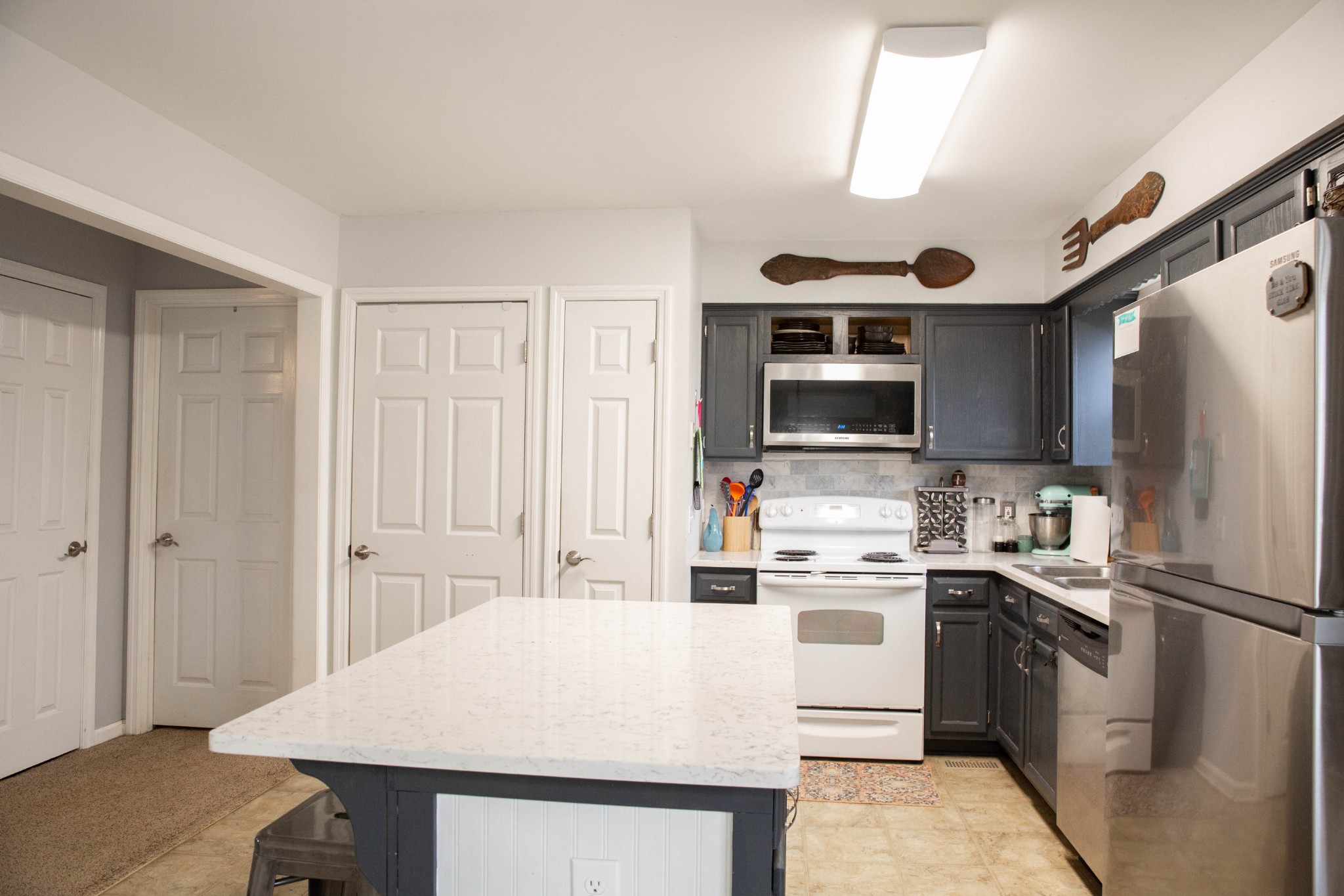 3633 Rutherford Drive Spring Hill, TN 37174 - Photo 7 of 26 a kitchen with stainless steel appliances a stove a sink and a refrigerator