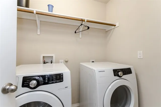 a bathroom with a double vanity sink toilet and a mirror