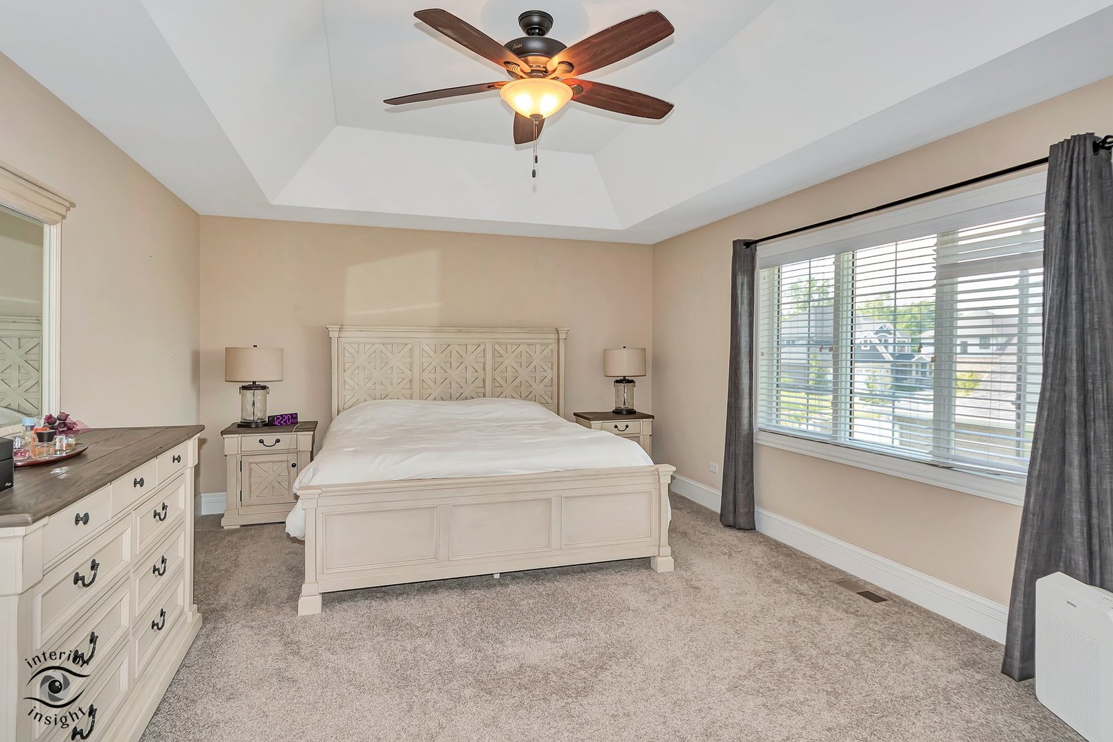 13754 Memorial Drive Manhattan, IL 60442 - Photo 18 of 37 a bedroom with a bed and a chandelier fan