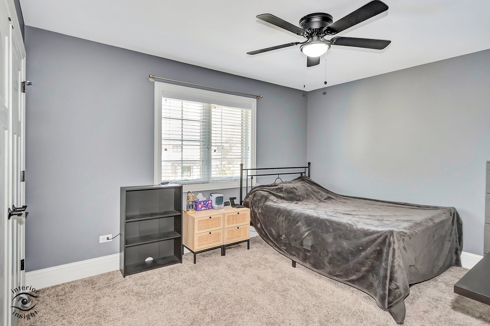 13754 Memorial Drive Manhattan, IL 60442 - Photo 24 of 37 a bedroom with a bed and a chandelier