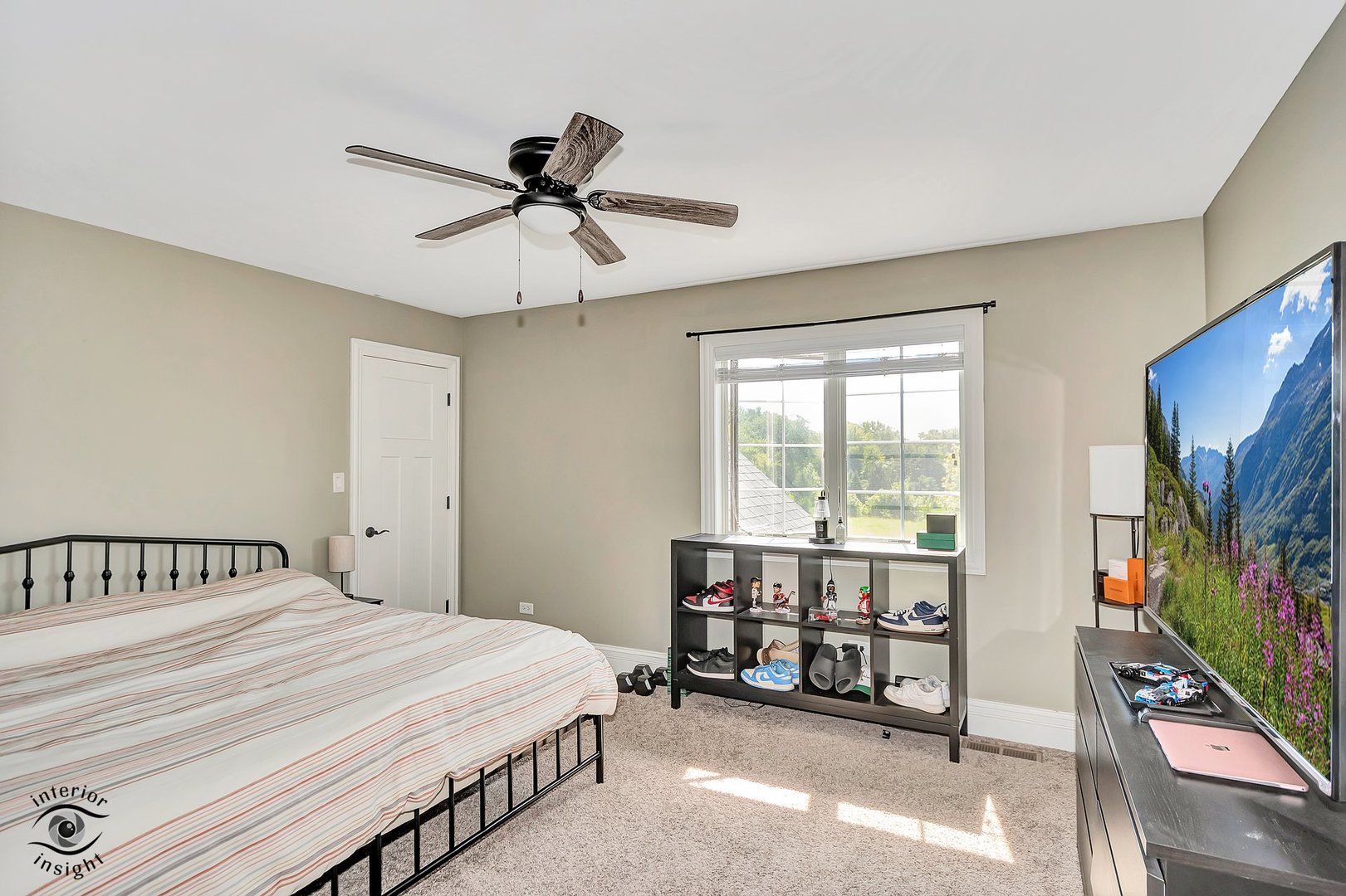 13754 Memorial Drive Manhattan, IL 60442 - Photo 25 of 37 a bedroom with a bed window and a flat tv screen