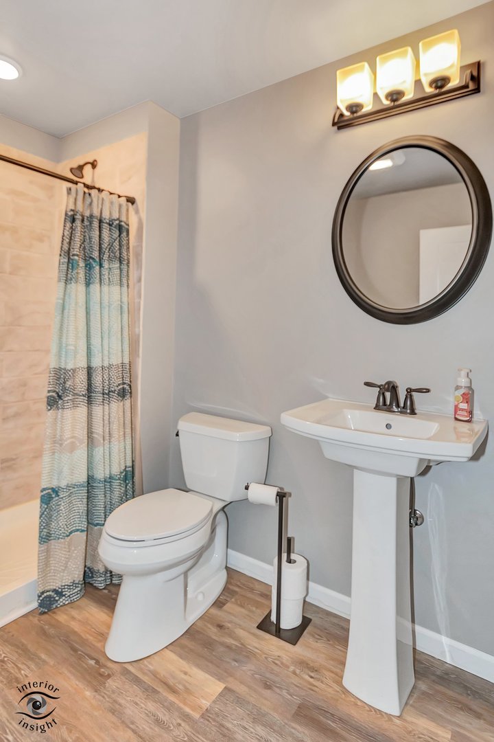 13754 Memorial Drive Manhattan, IL 60442 - Photo 32 of 37 a bathroom with a sink toilet and a mirror