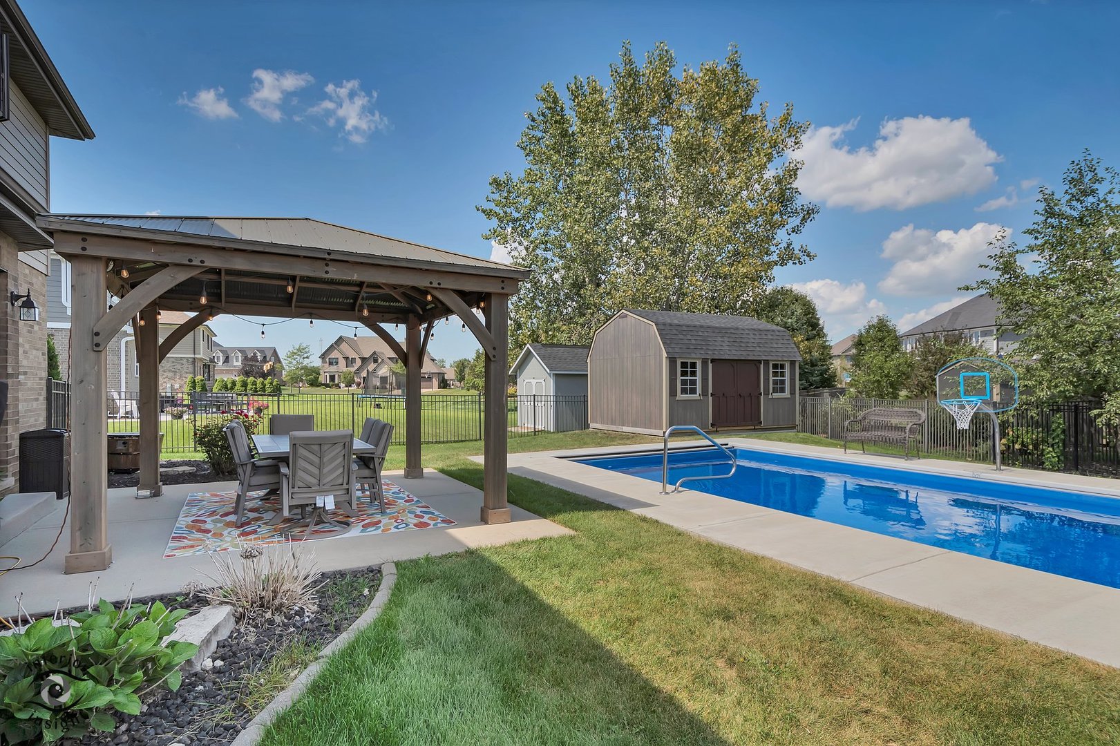 13754 Memorial Drive Manhattan, IL 60442 - Photo 34 of 37 a view of a porch with furniture and a yard