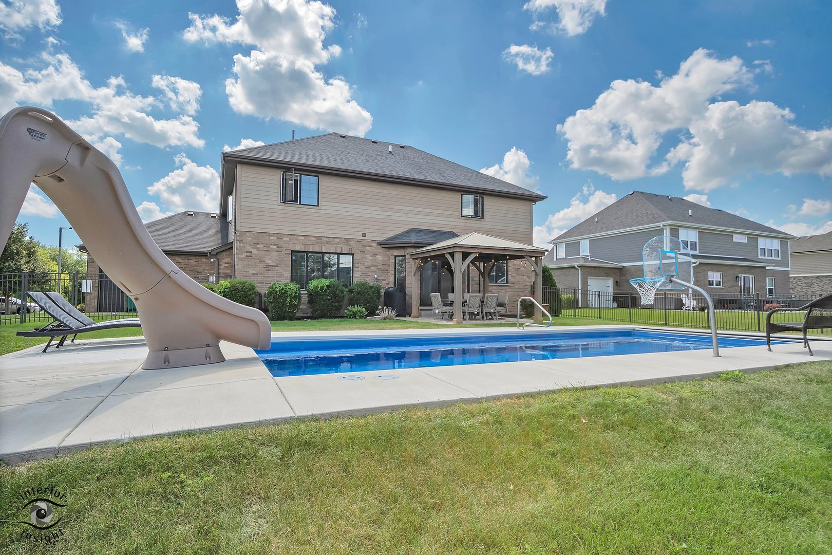13754 Memorial Drive Manhattan, IL 60442 - Photo 36 of 37 a view of a house with a swimming pool and a yard