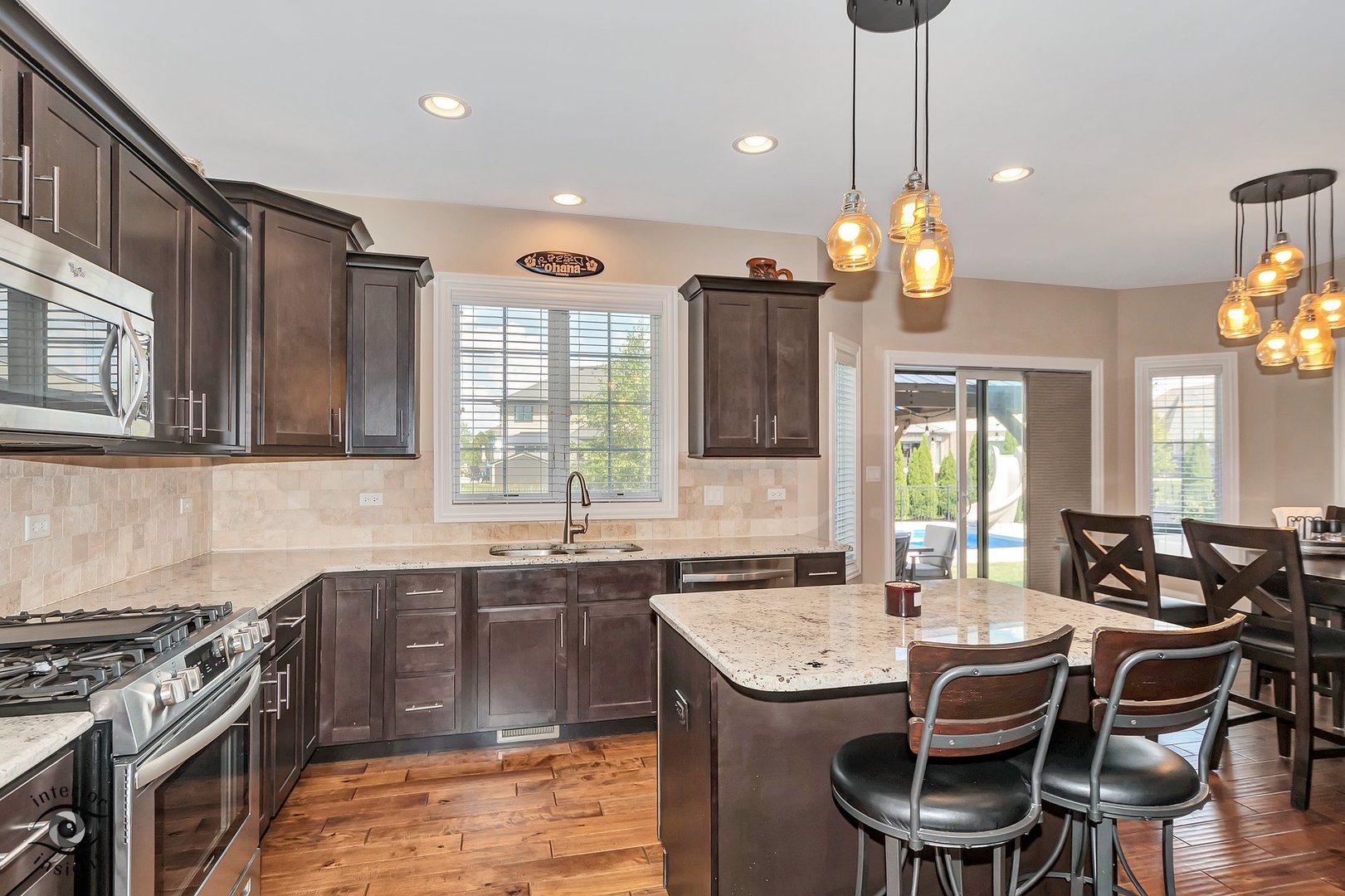 13754 Memorial Drive Manhattan, IL 60442 - Photo 9 of 37 a kitchen with granite countertop a sink a counter space appliances and cabinets
