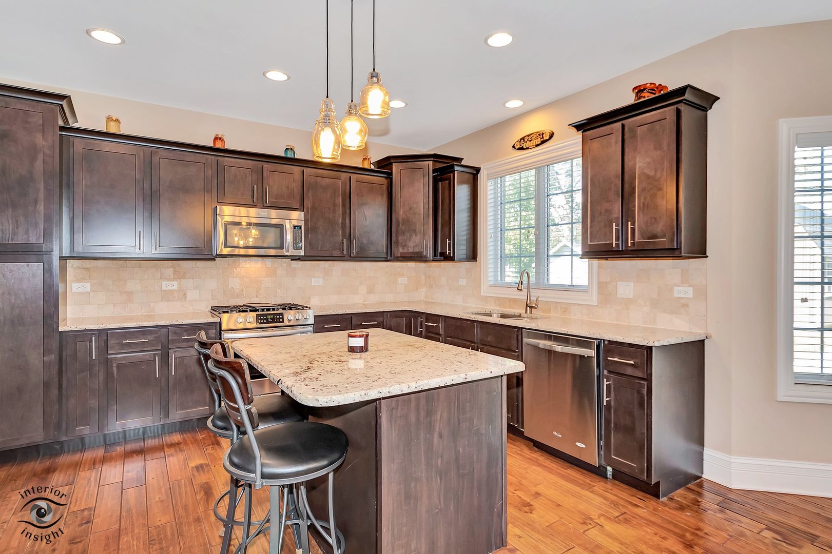13754 Memorial Drive Manhattan, IL 60442 - Photo 10 of 37 a kitchen with stainless steel appliances granite countertop a sink a stove and a refrigerator