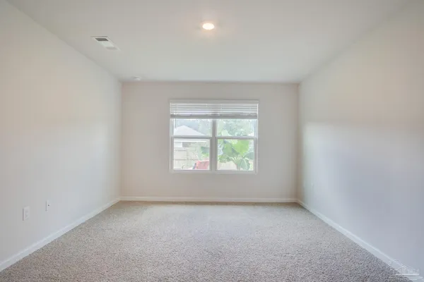 a bathroom with a granite countertop sink a mirror and a shower
