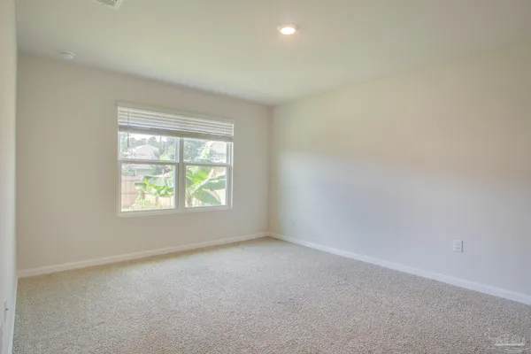 a bathroom with a granite countertop bathtub shower sink and vanity