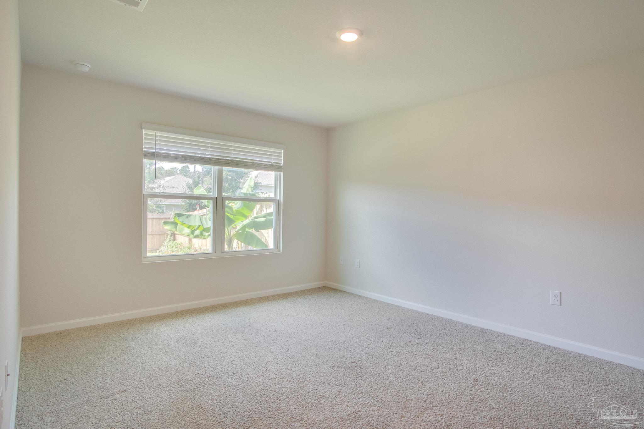 4383 White Cedar Court Pace, FL 32571 - Photo 16 of 36 an empty room with windows