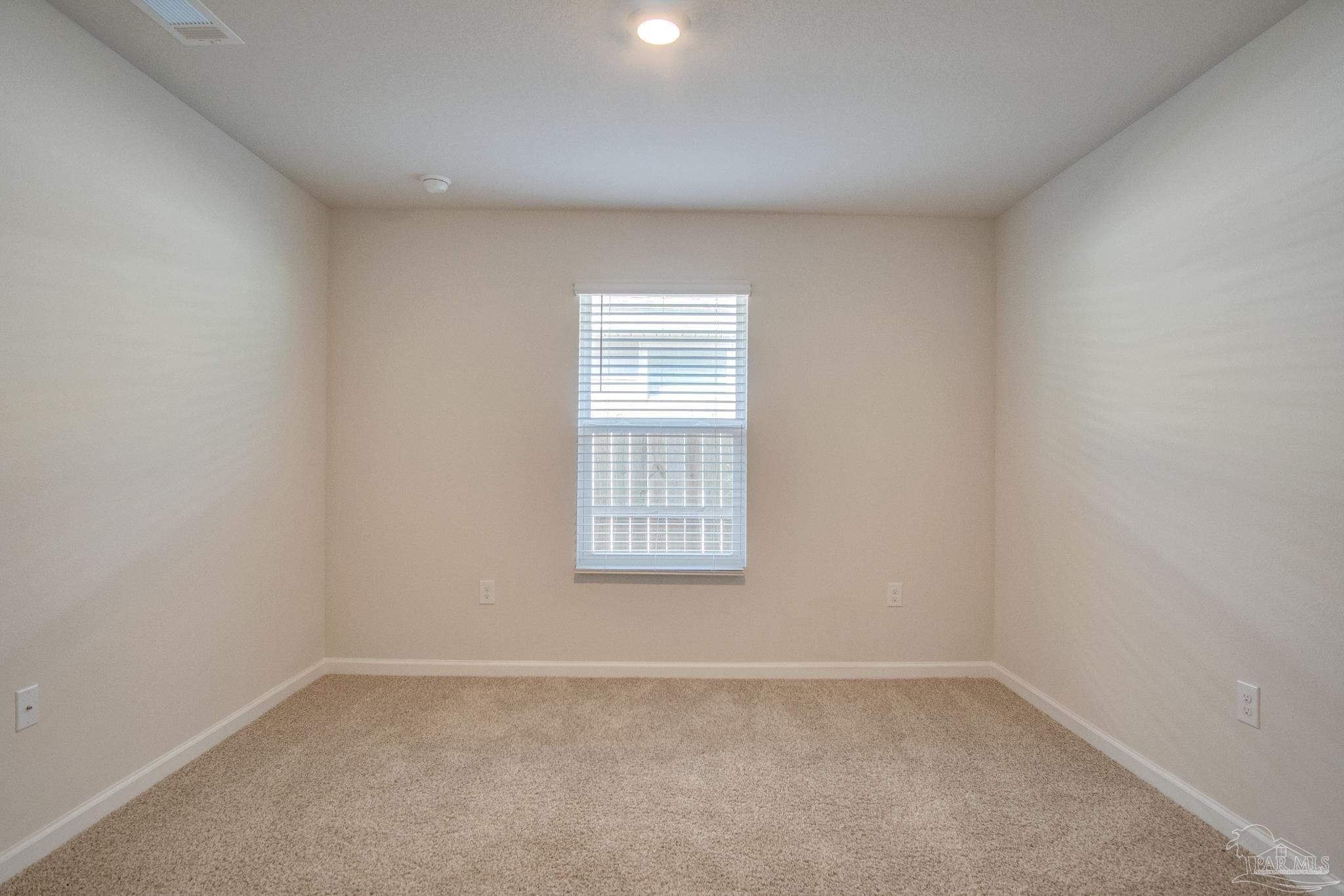 4383 White Cedar Court Pace, FL 32571 - Photo 24 of 36 an empty room with a window