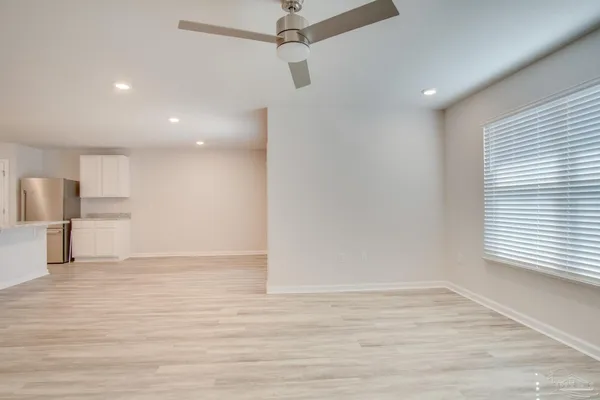 a kitchen with a sink and refrigerator