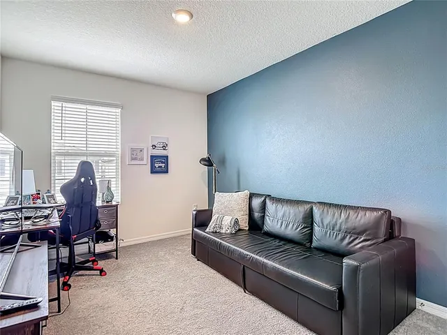 a bedroom with a bed and a cabinets