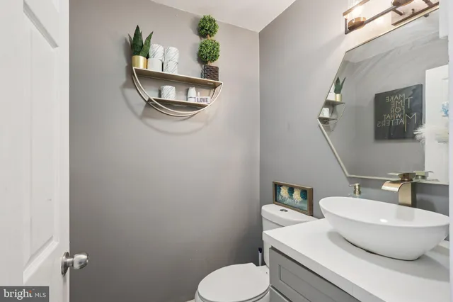 a bathroom with a toilet and a sink