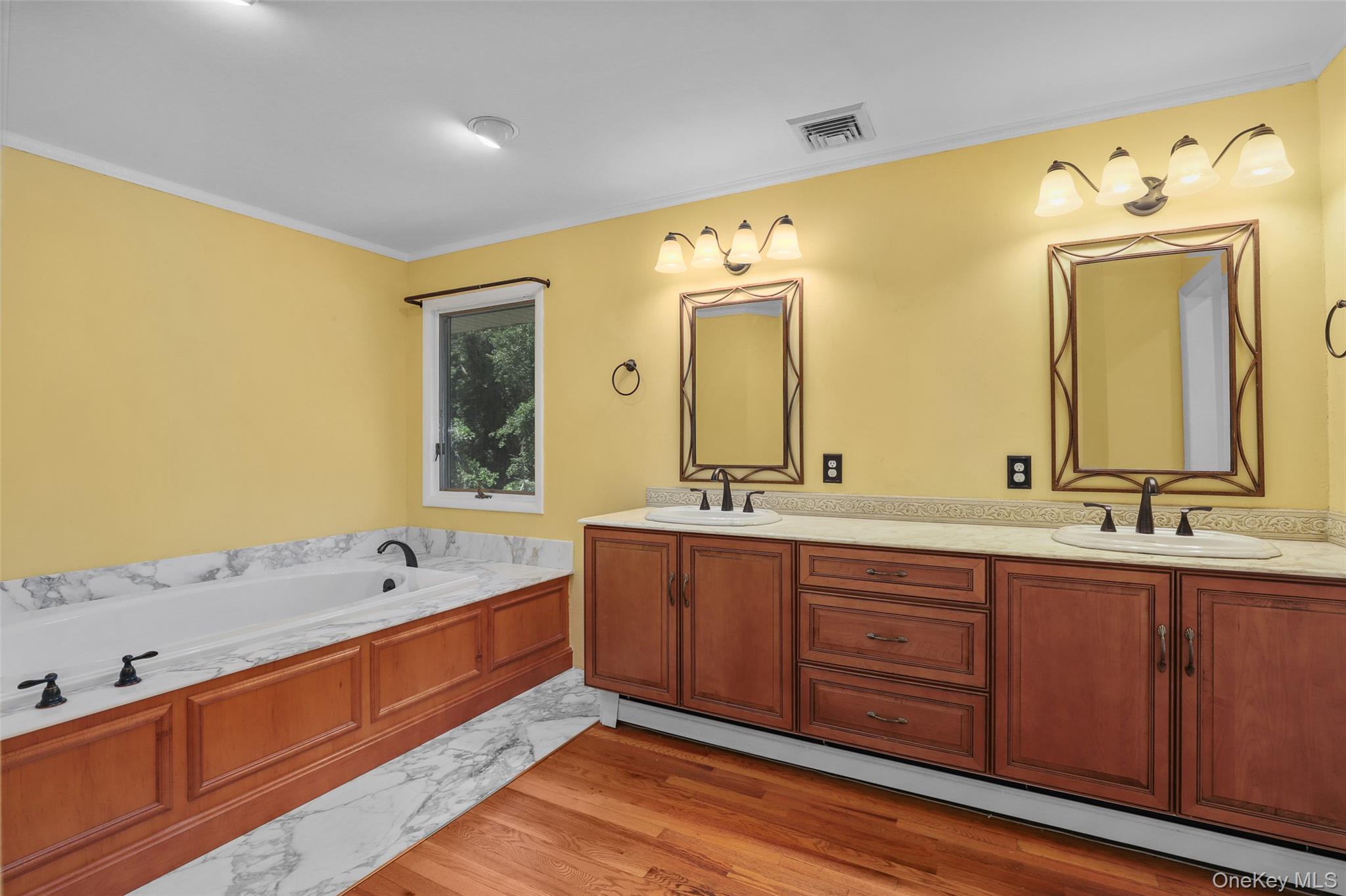 30 Eddy Road Verbank, NY 12585 - Photo 17 of 31 a spacious bathroom with a double vanity sink large mirror and a bathtub