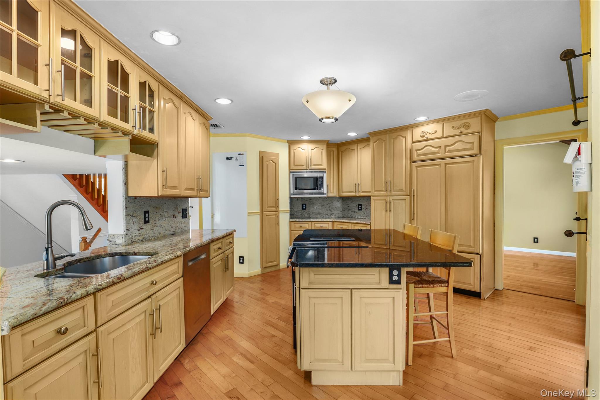 30 Eddy Road Verbank, NY 12585 - Photo 9 of 31 a large kitchen with stainless steel appliances a stove a sink dishwasher and a refrigerator with wooden floor