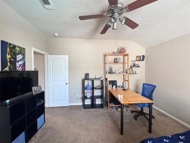 a view of a livingroom with furniture and a flat screen tv