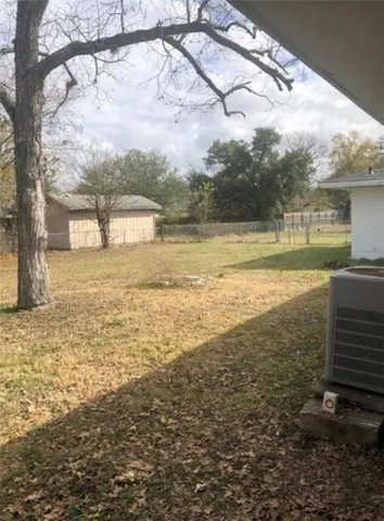 a view of a yard next to a building with a yard