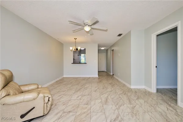 a view of livingroom with a ceiling fan
